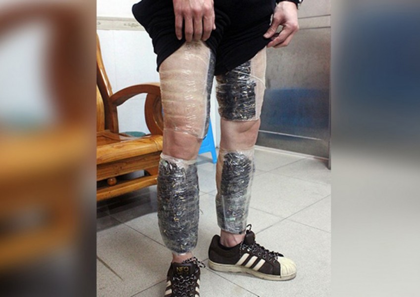 Smuggler nabbed with 9,000 memory cards strapped to legs