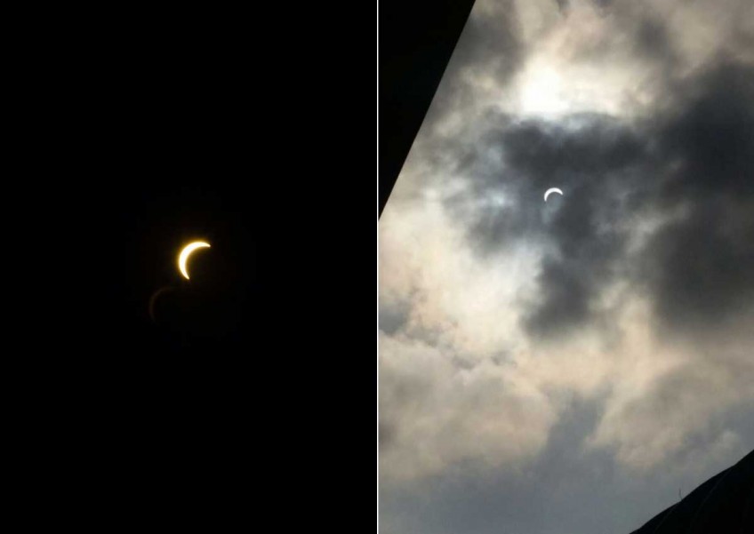 Thousands in Singapore catch glimpse of solar eclipse
