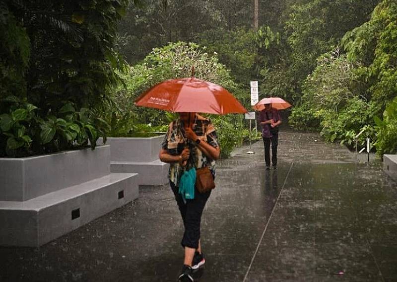 Why is Singapore raining so heavily recently?