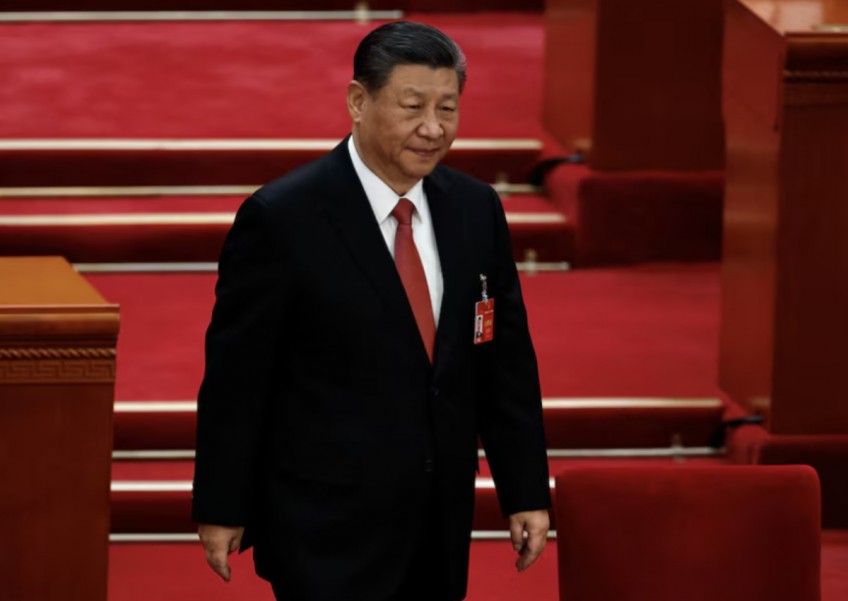China's President Xi meets US executives, academics in Beijing