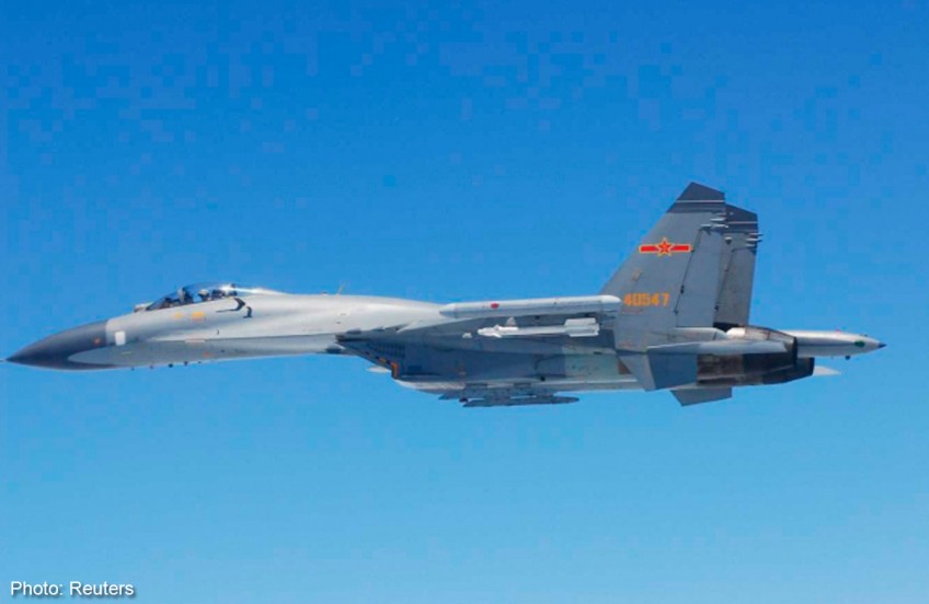 China says scrambled jets in response to Japanese air intrusion