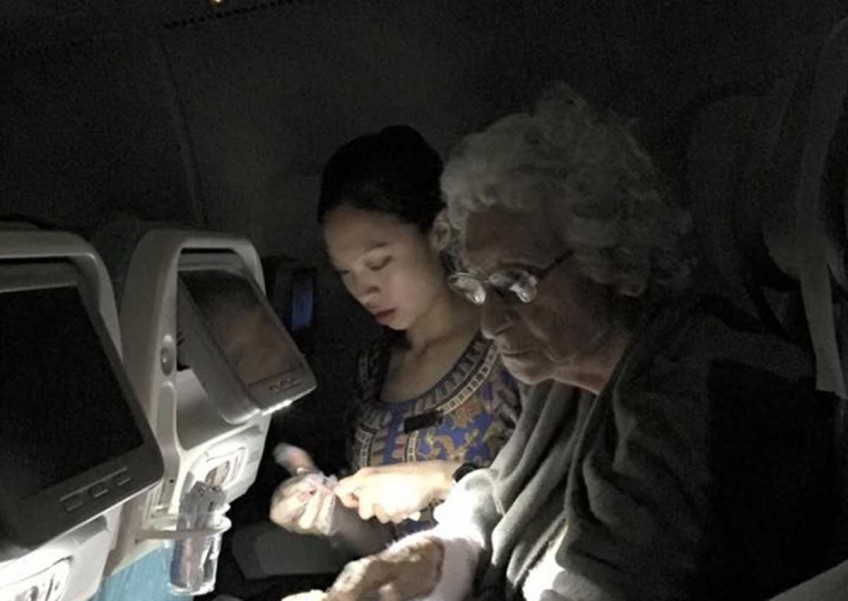 SIA stewardess widely praised for helping elderly diabetic woman on flight