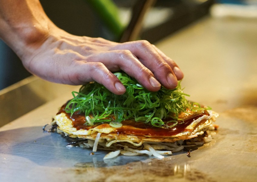 Sauerkraut or sardines? Hiroshima's pancake goes global for G-7 summit