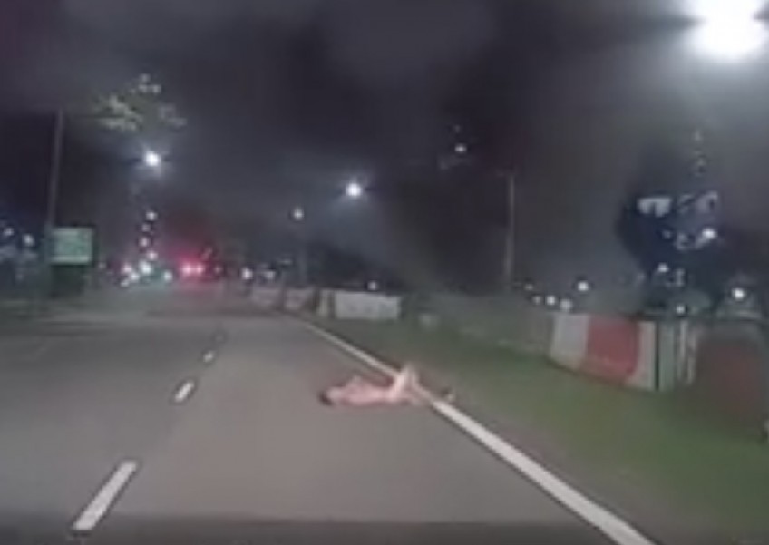 Man caught on video lying naked on Sembawang road, gets arrested
