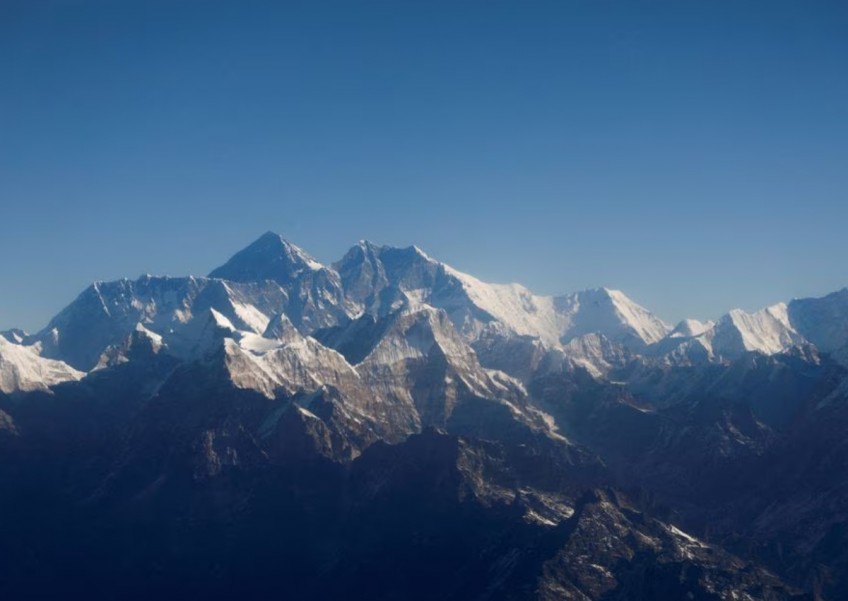 Renowned US mountaineer climbs rare Everest 'triple crown'