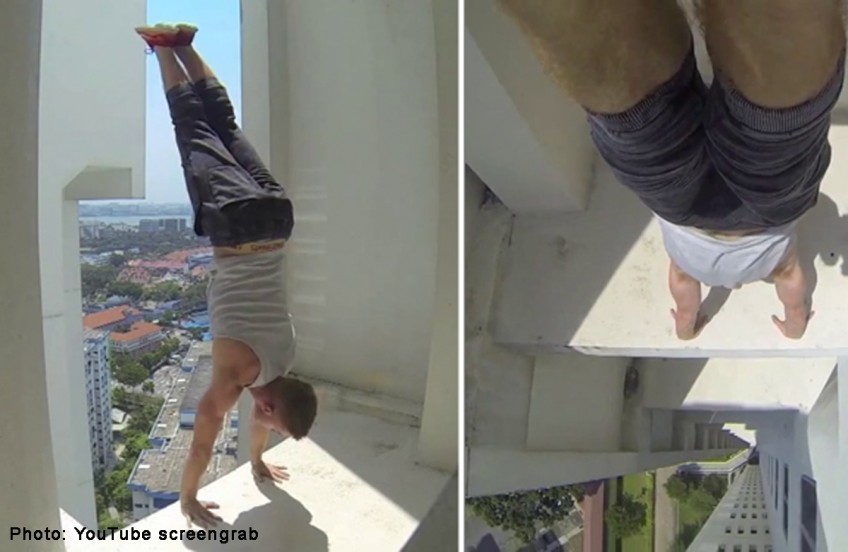 Man performs handstand on edge of 24-storey building in Singapore