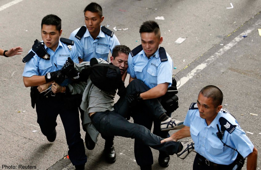 Scuffles break out as Hong Kong clears part of protest site