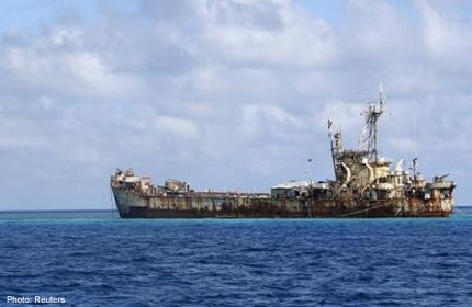 China defies US call to stop island project in South China Sea