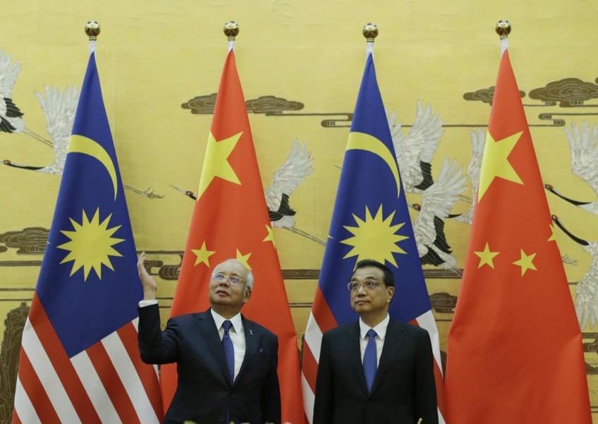 Najib asks West to stop 'lecturing' as Malaysia embraces China