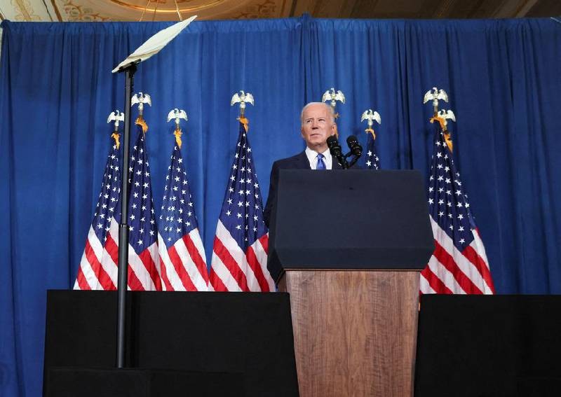 Biden warns election deniers pose threat, blames Trump