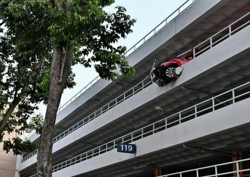 Car hangs on edge after crashing through 4th-storey wall in Bukit Merah