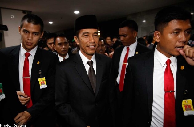 Indonesia's Widodo adds Islamist party to reduce coalition's minority 