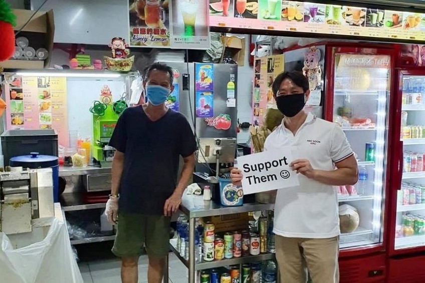 MP Louis Ng will not face criminal charges for holding placard in support of hawkers: AGC