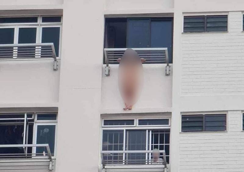 Naked woman who fell from ledge outside Yishun HDB window 'not a migrant domestic worker', says MOM