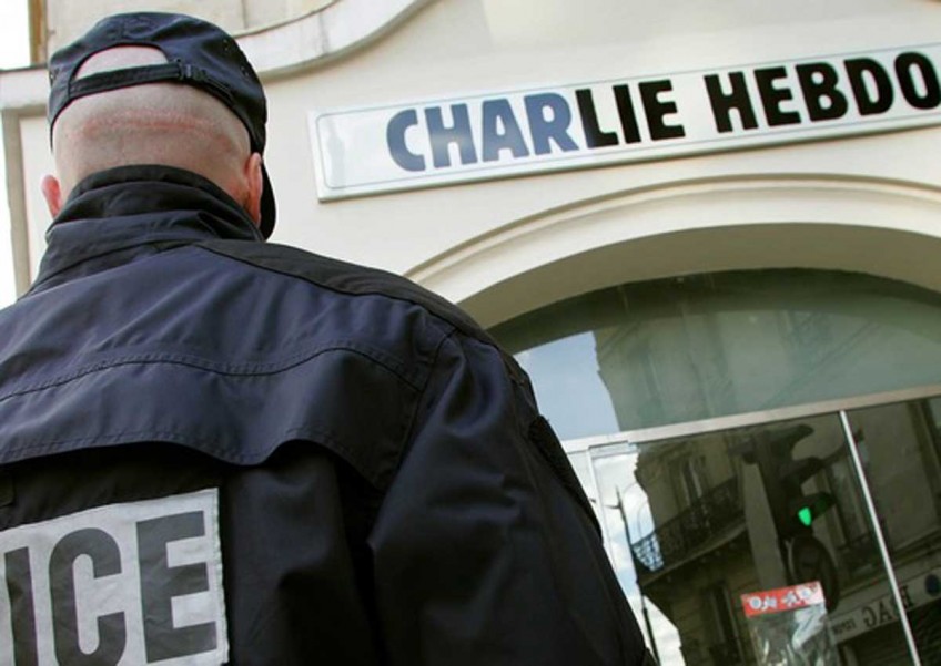 Charlie Hebdo moves into new high-security offices