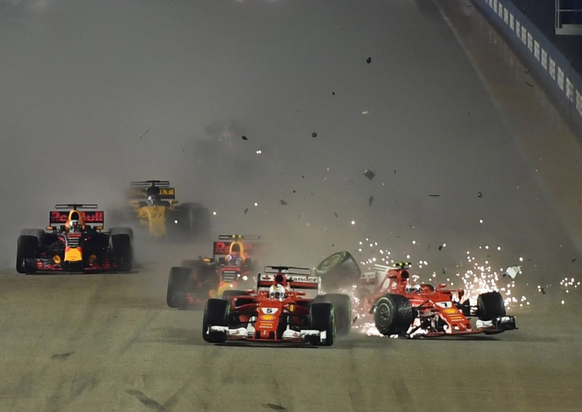 Formula One: Both Ferraris crash out in wet Singapore
