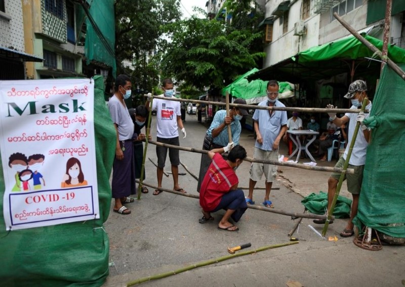 Myanmar residents barricade city streets as coronavirus cases rise