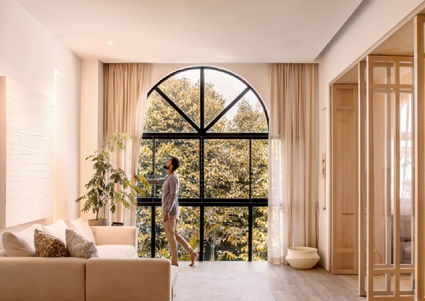 Inside a serene apartment sanctuary nestled amidst lush greenery