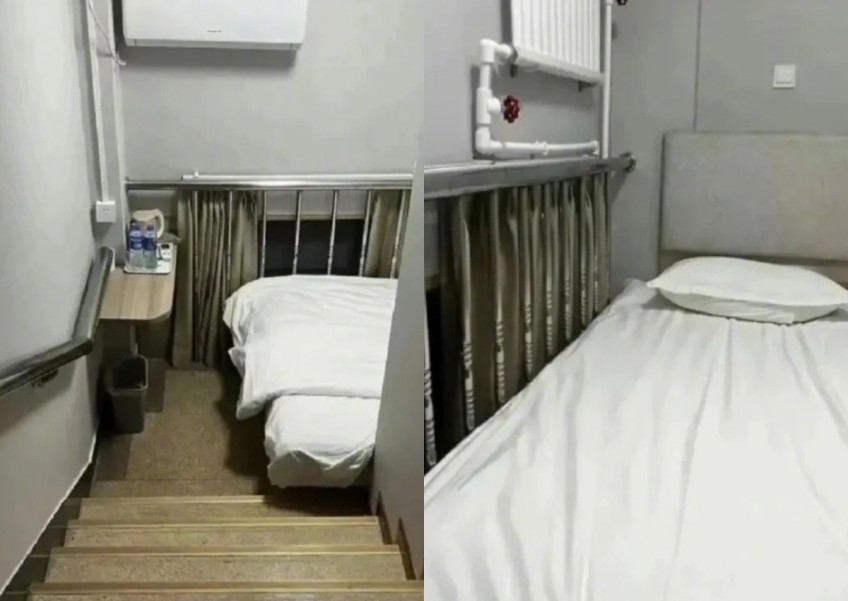 Next-level accommodation: Beijing hotel squeezes bed into stairwell and offers it as room