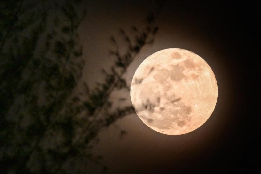 Skygazers get lucky as break in clouds lets them catch supermoon on Mid-Autumn festival