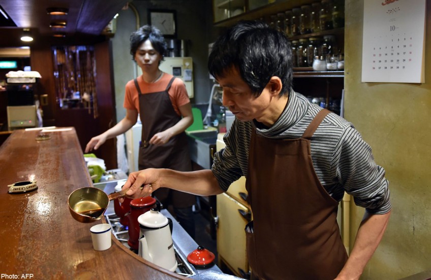 Japan's dated, smoky cafes unfazed by Starbucks success
