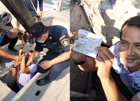 No joke: Crane operator lowers Thai official into manhole to help woman retrieve winning lottery ticket